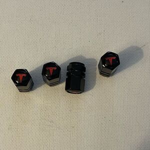 Tesla valve Stem caps in black set of 4 NWT